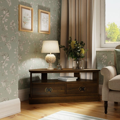 Garrat Chestnut corner TV unit from Laura Ashley features two spacious drawers with metal drop handles, and an open shelving unit for easy cable access