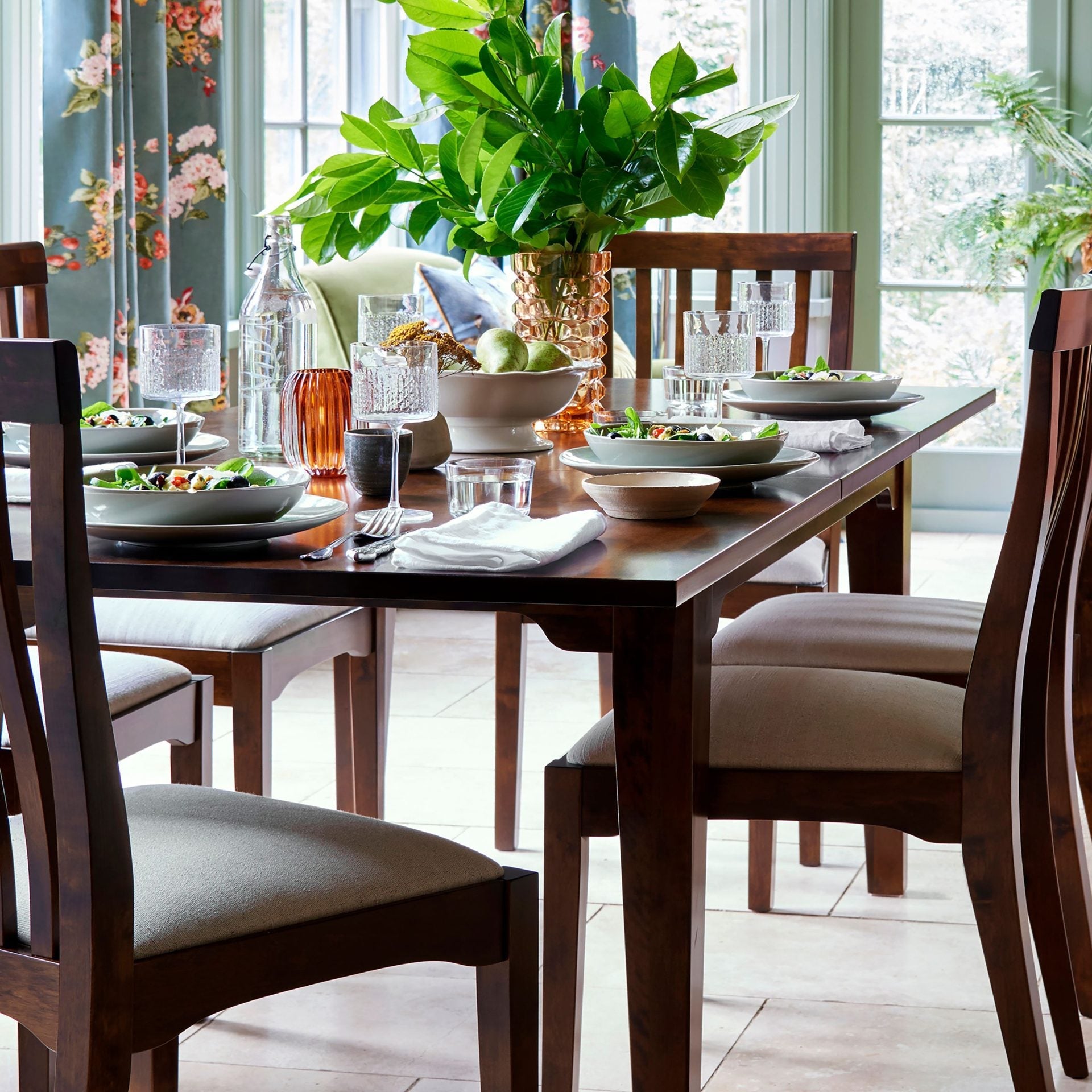 Laura Ashley Garrat rectangular extending dining table in chestnut finish with solid wood construction and traditional styling.