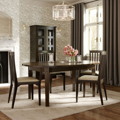 Laura Ashley Garrat honey oval dining table with extendable leaf that can accommodate 6-8 people, warm wood grain and elegant traditional detailing.