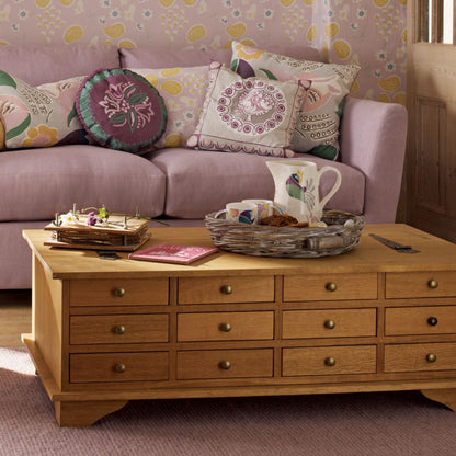 Laura Ashley Garrat 12 Drawer Coffee Table in a warm honey coloured birch wood with metal drawer knobs and lift up table top