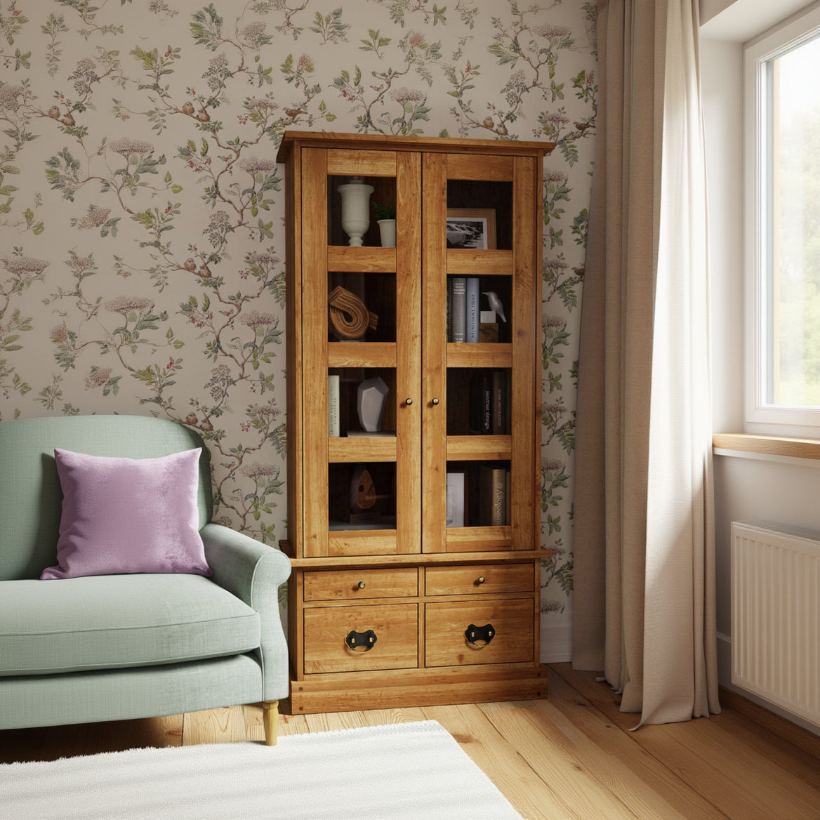 Laura Ashley Garrat display cabinet ideal for showcasing glassware, books and decorative pieces. Crafted from a classic honey birch wood with glass panelled doors and 4 drawers for organised home storage