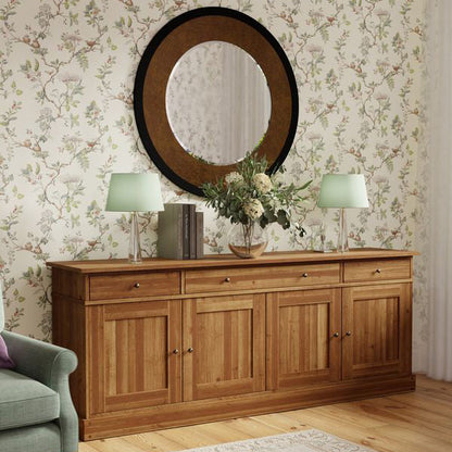 Laura Ashley large traditional honey wood cabinet with 3 top drawers and 4 cabinet doors with internal shelving for storage, complemented with brushed metal handles