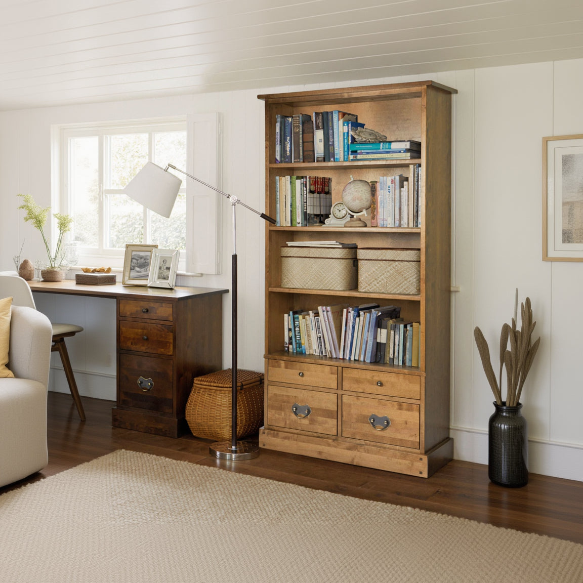 Laura Ashley Garrat Honey 4 Drawer Single Bookcase features 4 deep spacious shelves and 4 lower storage drawers made from a warm honey coloured solid birch wood.