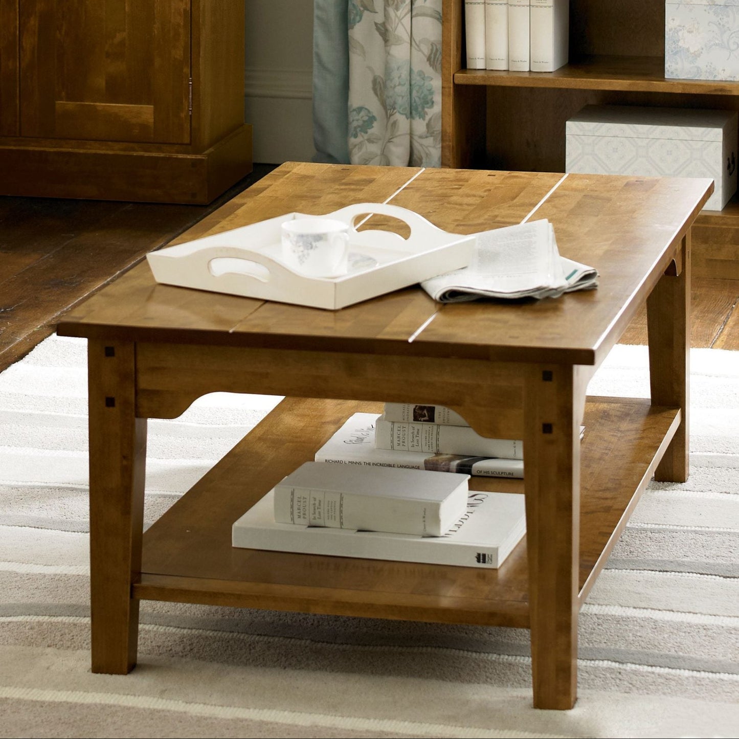 Laura Ashley Garrat wooden coffee table with clean rectangular silhouette, shelf underneath and timeless country-style appeal.