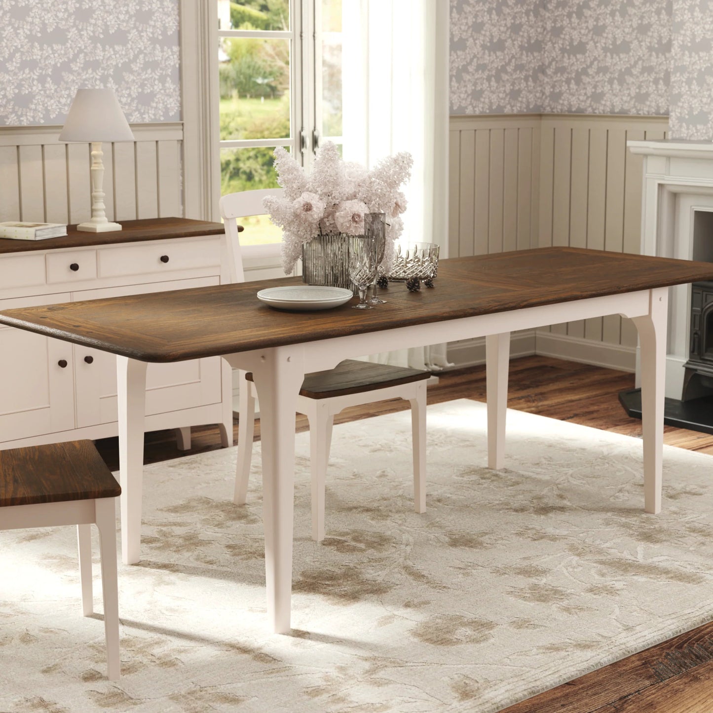The Laura Ashley extending dining table from the Hapton range has a dark wood top and soft truffle coloured legs and can seat from 6-8 people, matching chairs are available