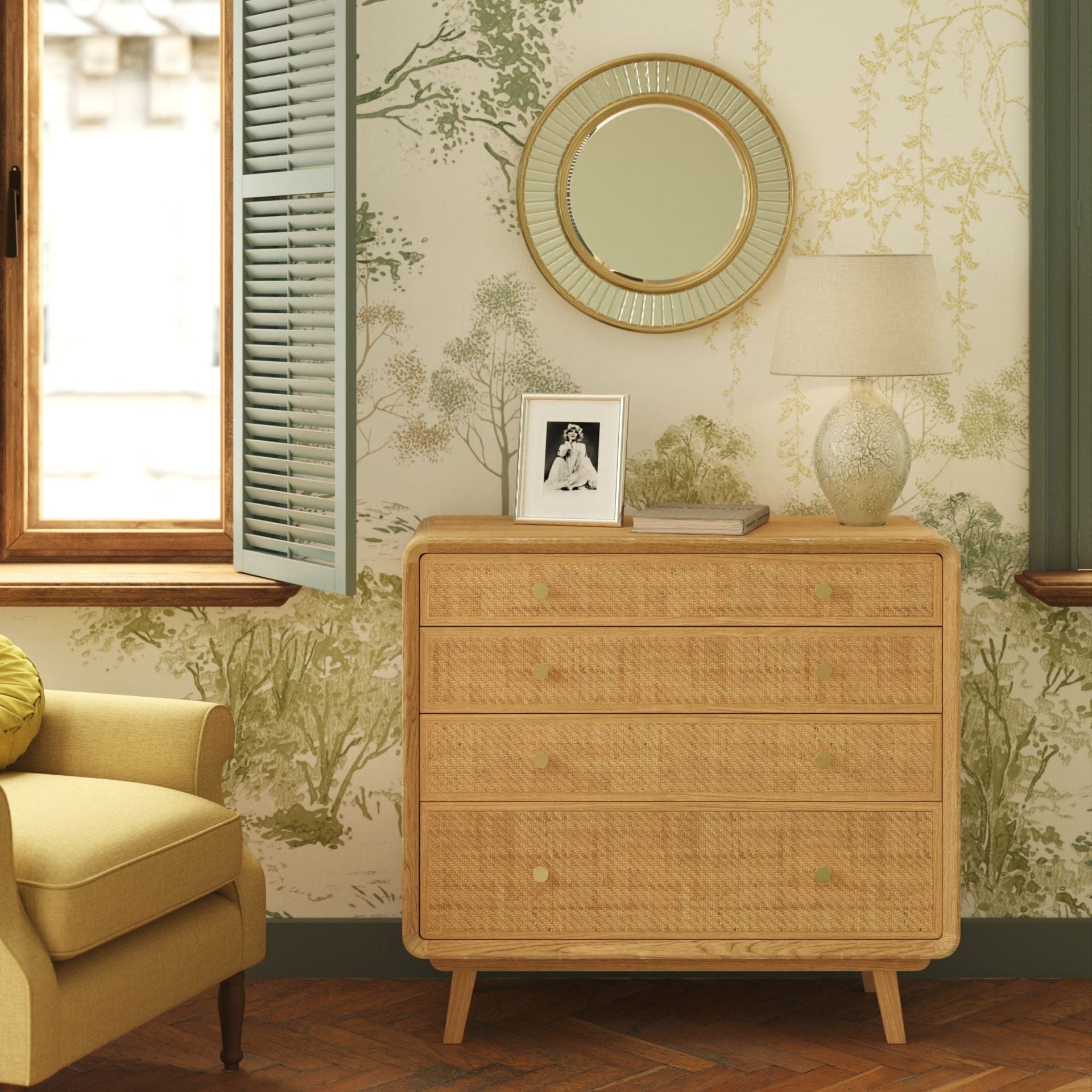 Laura Ashley Millen 4 drawer chest made from solid oak and oak veneers with natural rattan drawer fronts and gold knobs in a mid century design