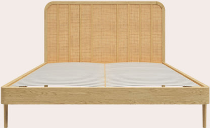 Laura Ashley Millen 6ft bed crafted from solid oak and oak veneers with distinctive rattan panel headboard