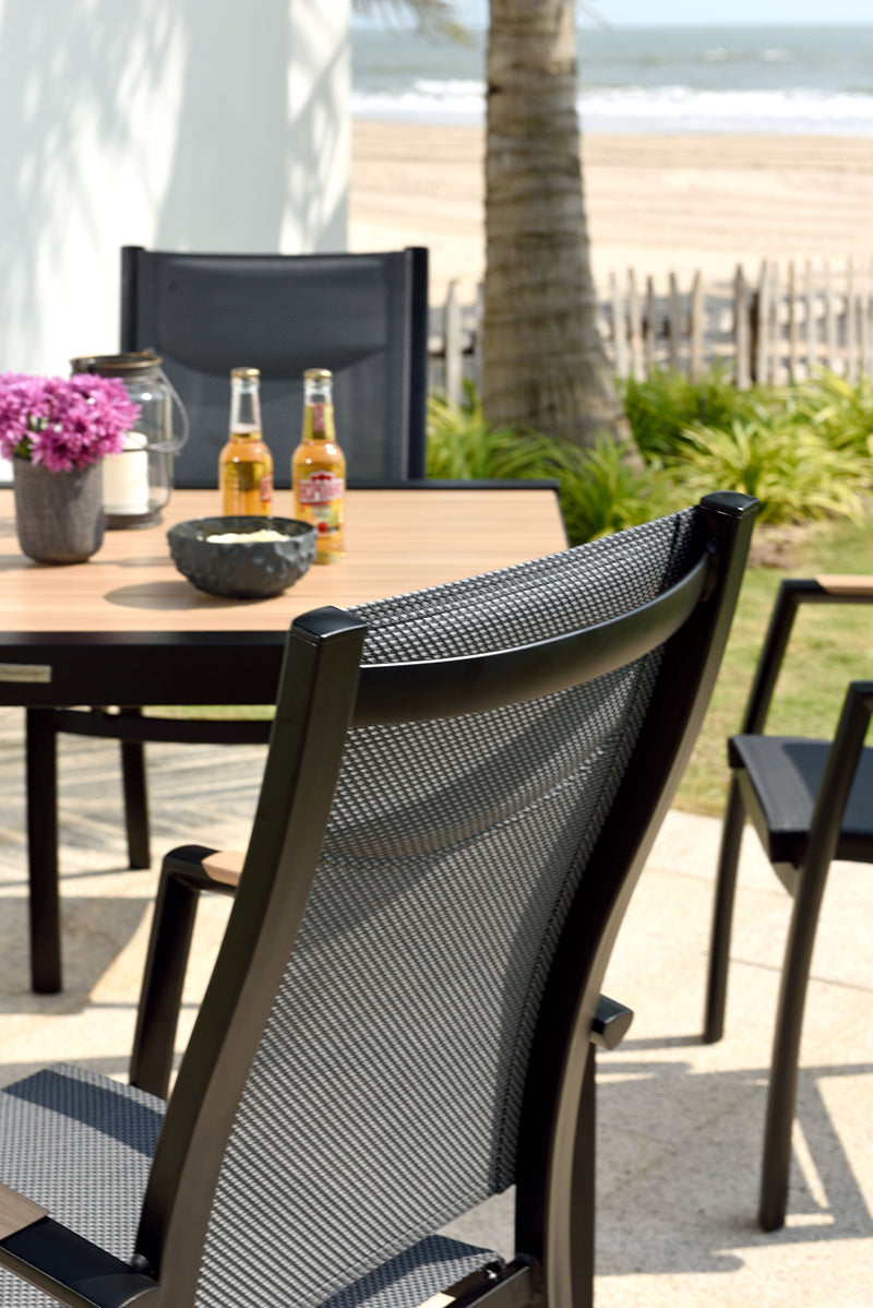 Panama 4 Seater Dining Set features a square table with slatted wood-effect table top and 4 matching armchairs with black aluminium frames and textilene seat and backrest