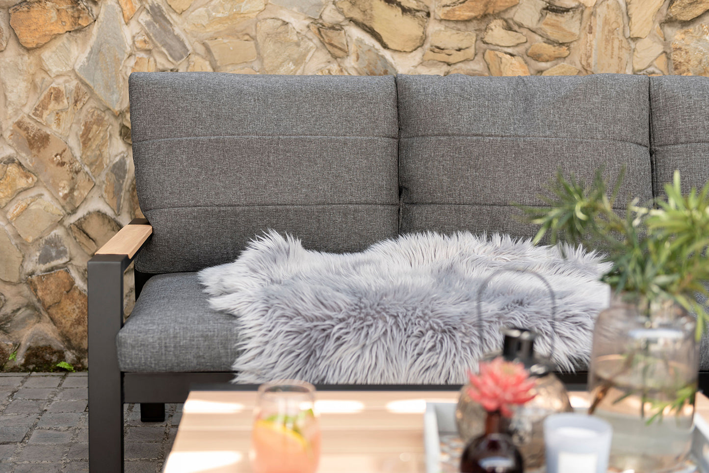 Panama Corner Set features a Black aluminium frame with wood-effect armrest detail and grey padded cushions