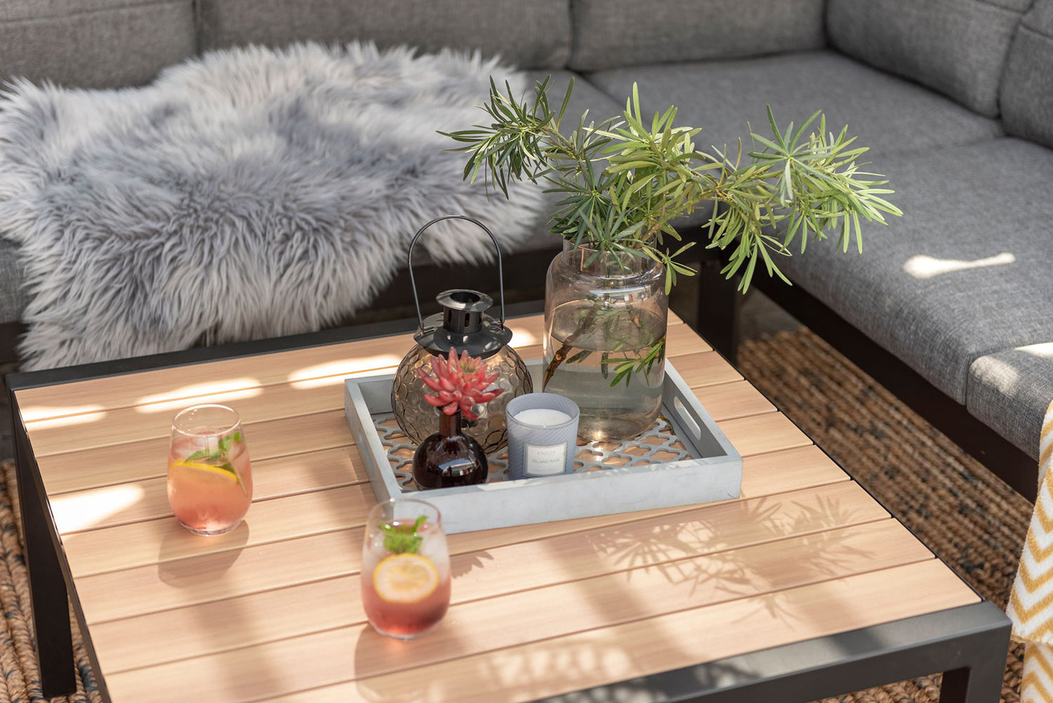 Panama Corner Set in Black features a corner sofa and a square coffee table with slatted wood-effect top and black aluminium frame