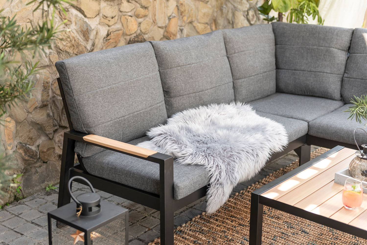 Panama Corner Set consists of a corner sofa and a square coffee table, constructed from black aluminium with wood-effect details and grey padded cushions