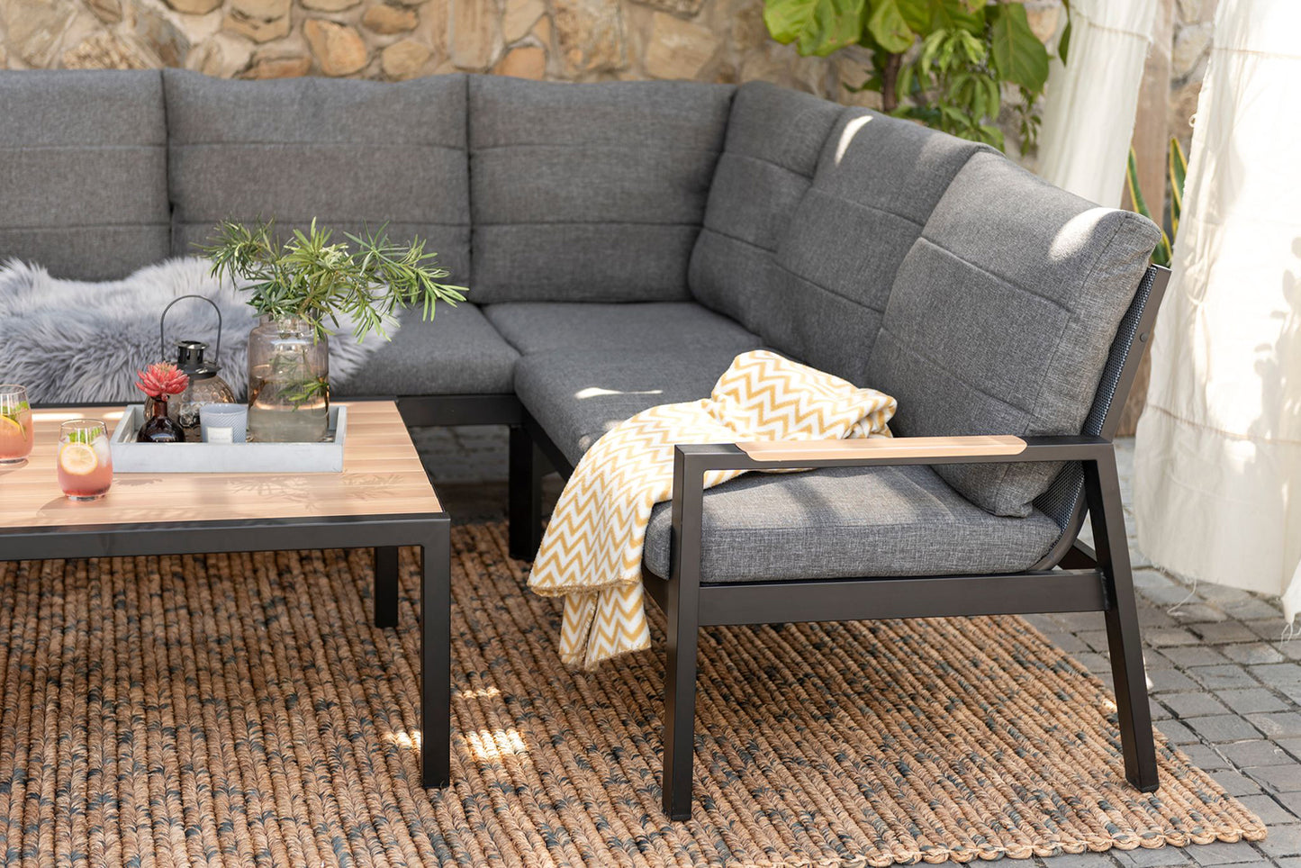Panama Corner Set features a 4-5 seater corner sofa with grey padded cushions and a matching square coffee table with wood-effect table top