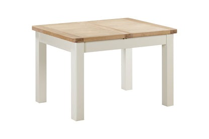 Papaya Foxington 120cm-153cm Extending Dining Table in an off white painted wood with natural oak table top, the extending leaf sits neatly within the table, seating 4-6 guests