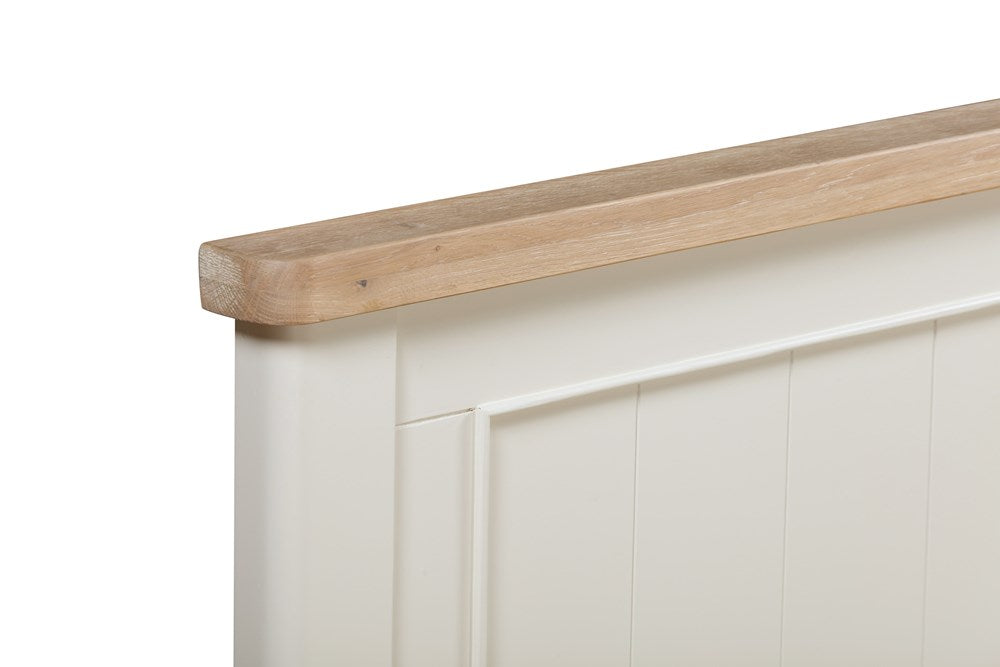 Papaya Foxington 150cm King Size Bed features an off white panelled headboard with a natural solid oak trim