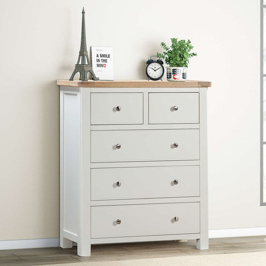 Papaya Foxington 5 drawer Chest features 2 smaller top drawers and 3 larger lower drawers painted in an off white colour with natural oak table top and silver drawer knobs