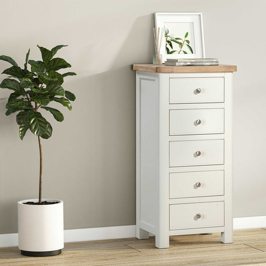 Papaya Foxington Tall 5 Drawer Chest features 5 storage drawers with silver handles. In an off white painted finish with a solid oak table top 