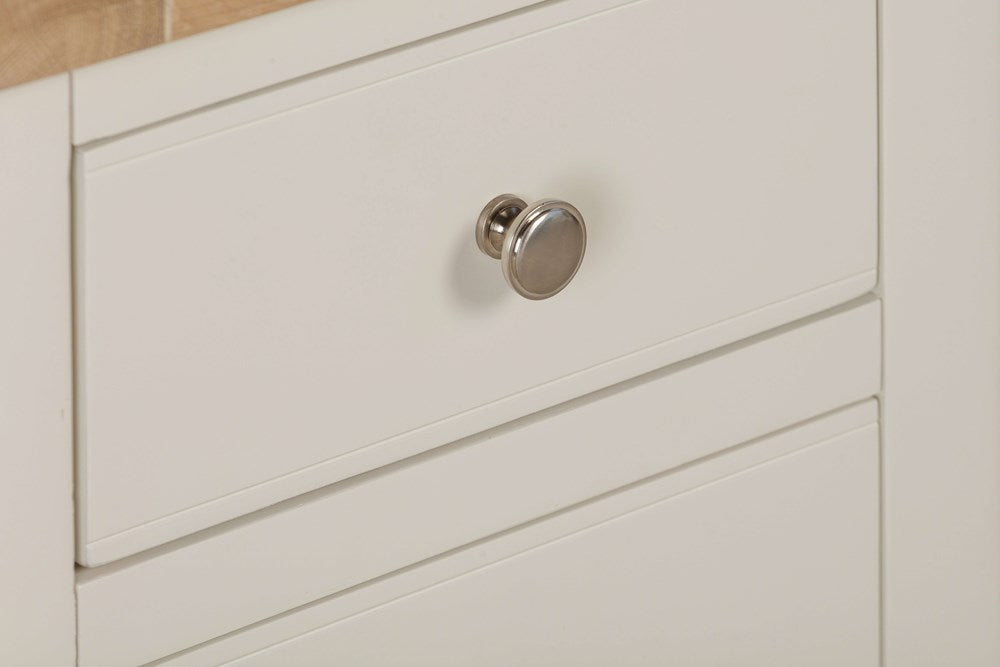 Papaya Foxington Bedside Table features 3 spacious storage drawers painted in off white with silver drawer knobs and a natural oak table top