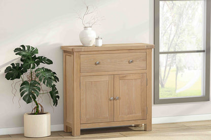 Papaya Foxington Compact Sideboard in Natural Oak features 2 cupboard doors with internal storage, plus 1 top drawer and silver handles