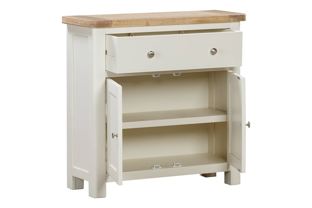 Papaya Foxington Compact Sideboard has 2 cupboard doors with internal shelving and a top drawer with silver metal handles. In an off white painted wood with natural solid oak top. 