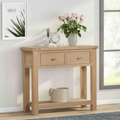 Papaya Foxington Console Table with 2 Drawers crafted from a solid Natural Oak also features a bottom shelf and metal drawer knobs