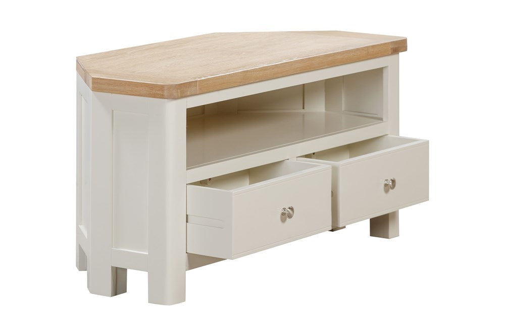 Papaya Foxington Corner TV Unit features an open shelf with cable access, 2 lower storage drawers in an off white painted finish, with a natural oak wood top and silver drawer knobs
