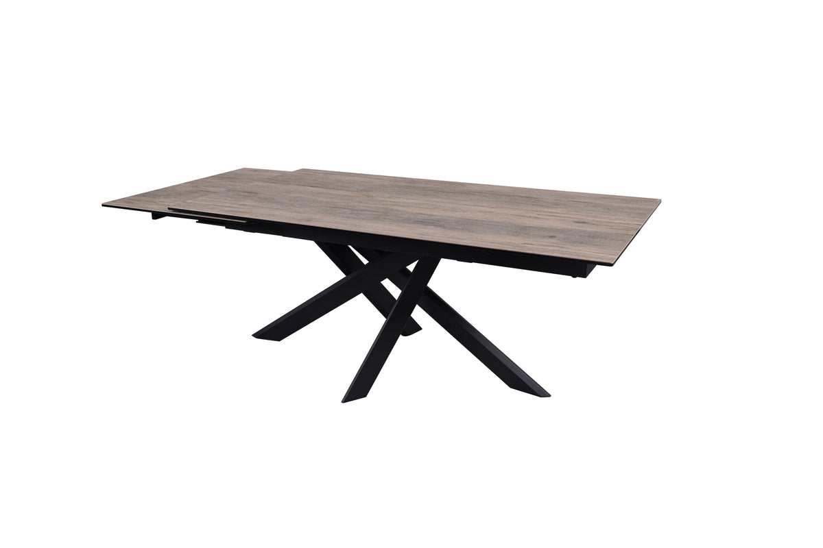 Angled studio view of the Ravenna 180cm Dining Table in Ceramic Woodgrain with its rectangular top and black sculptural base.