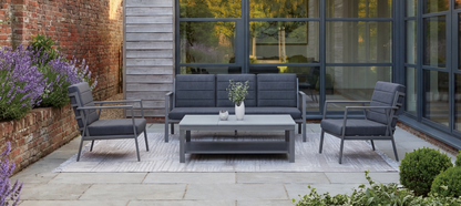 Royal Garden Catalina 4 Piece Lounge Set is a modern and sleek collection in a sophisticated charcoal grey finish, with a 3 seater sofa, 2 armchairs and a co-ordinating coffee table