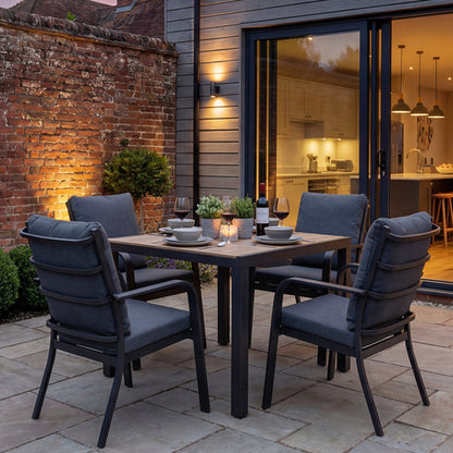 Royal Garden Cordoba 4 Seat Square Dining Set in charcoal grey with aluminium frame and polywood table top, and 4 generously cushioned armchairs