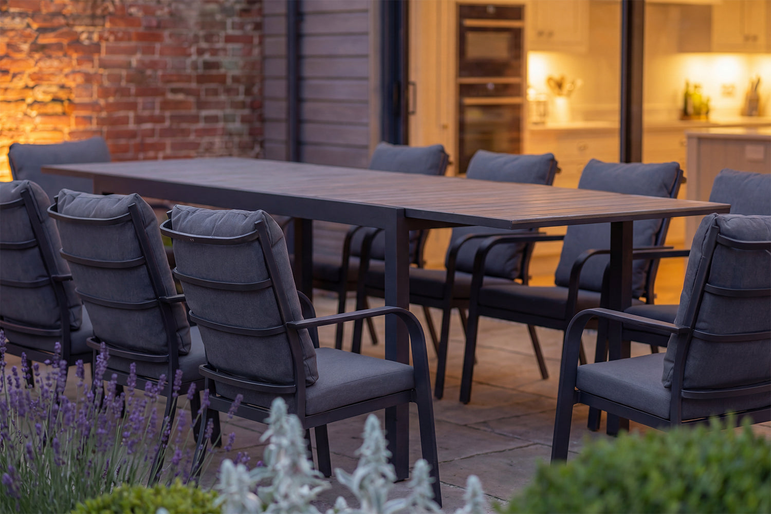 Royal Garden Cordoba 8 Seat Extending Dining Set made from robust aluminium and a durable polywood slatted table top, features 8 luxuriously cushioned armchairs for comfortable dining