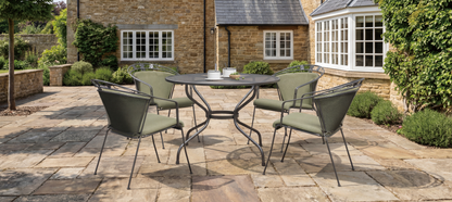 Royal Garden Elegance Dining Set features a round aluminium table with parasol hole and 4 elegant detailed chairs with green padded cushions