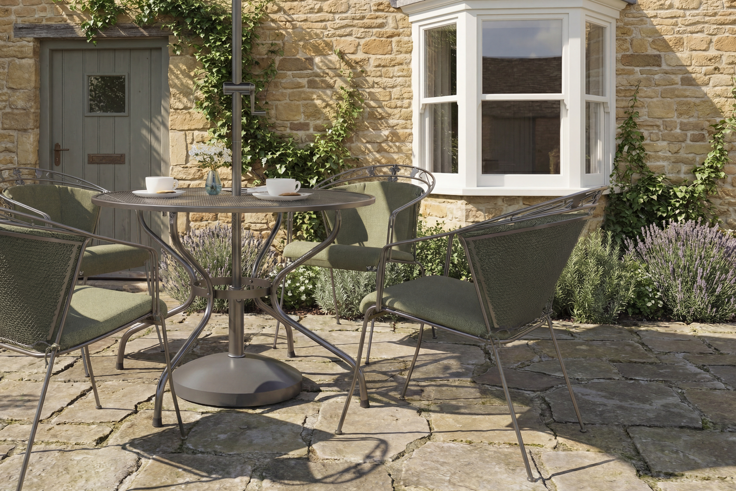 Royal Garden Elegance 4 Seat Dining Set features a round table with parasol hole, and 4 matching chairs with padded green cushions