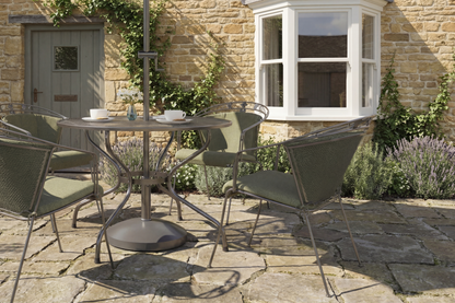 Royal Garden Elegance 4 Seat Dining Set features a round table with parasol hole, and 4 matching chairs with padded green cushions