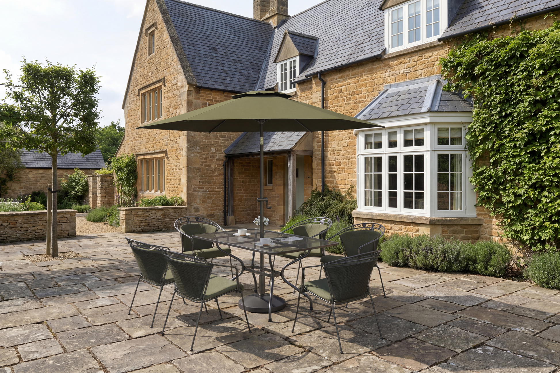 Royal Garden Elegance 6 Seat Dining Set features a rectangular dining table with aluminium frame and parasol hole, and 6 chairs with green padded seat cushions