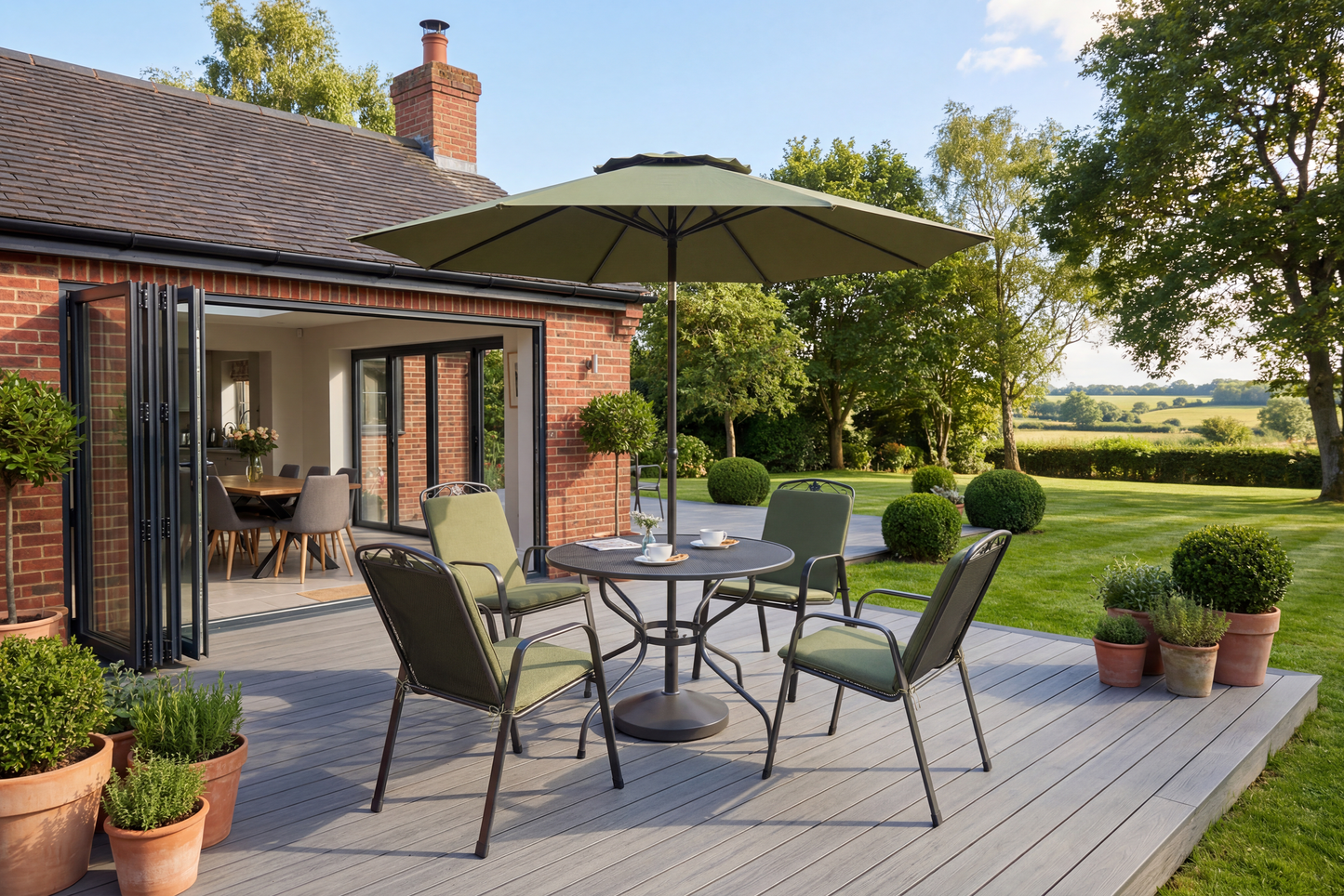The Royal Garden Savoy 7 piece Dining Set features a round table with 4 matching chairs, plus a coordinating parasol and parasol base are also included
