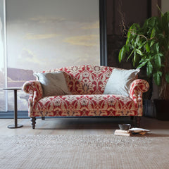 Tetrad Tallis Grand Sofa in Enigma Claret luxurious damask patterned upholstery, with cream scatter cushions and dark wooden legs