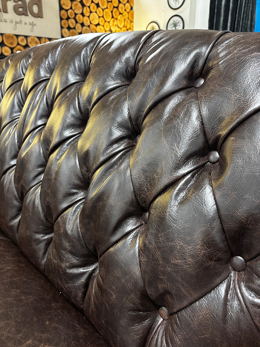 Tetrad Arbroath Petit Sofa in Dark Brown Hide is crafted in a classic Chesterfield style design with deep button tufted backrest and luxurious full grain leather that becomes softer and more characterful with use 