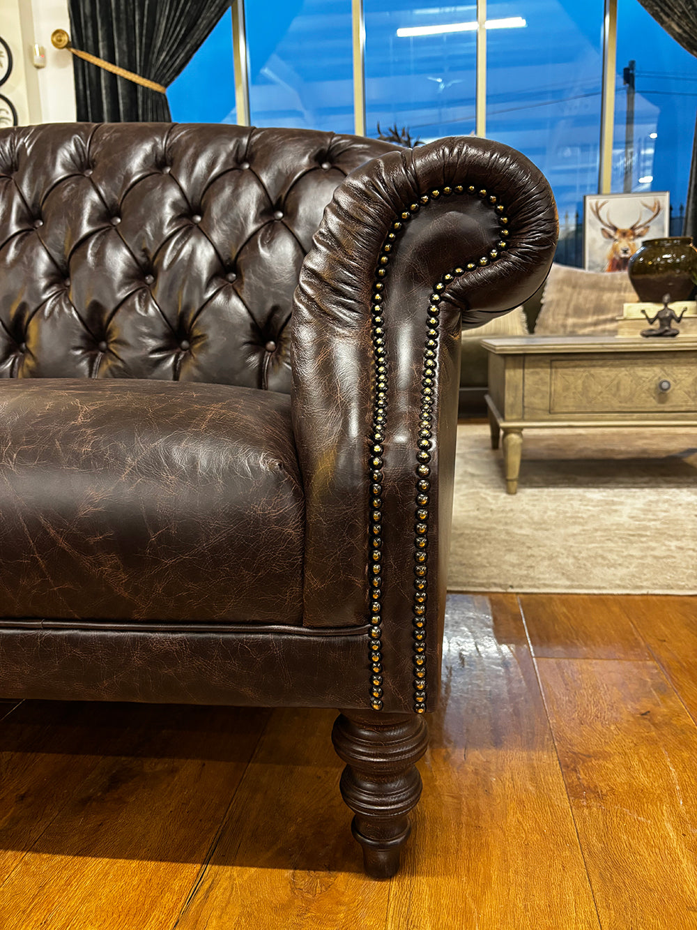 Tetrad Arbroath Petit Sofa in Dark Brown leather with scrolled arms, brass stud detailing and traditional turned legs in dark wood