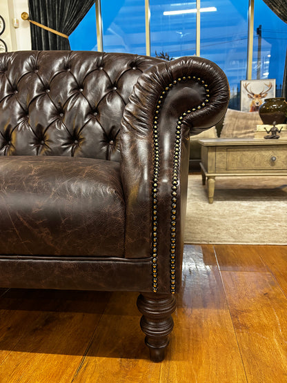 Tetrad Arbroath Petit Sofa in Dark Brown leather with scrolled arms, brass stud detailing and traditional turned legs in dark wood