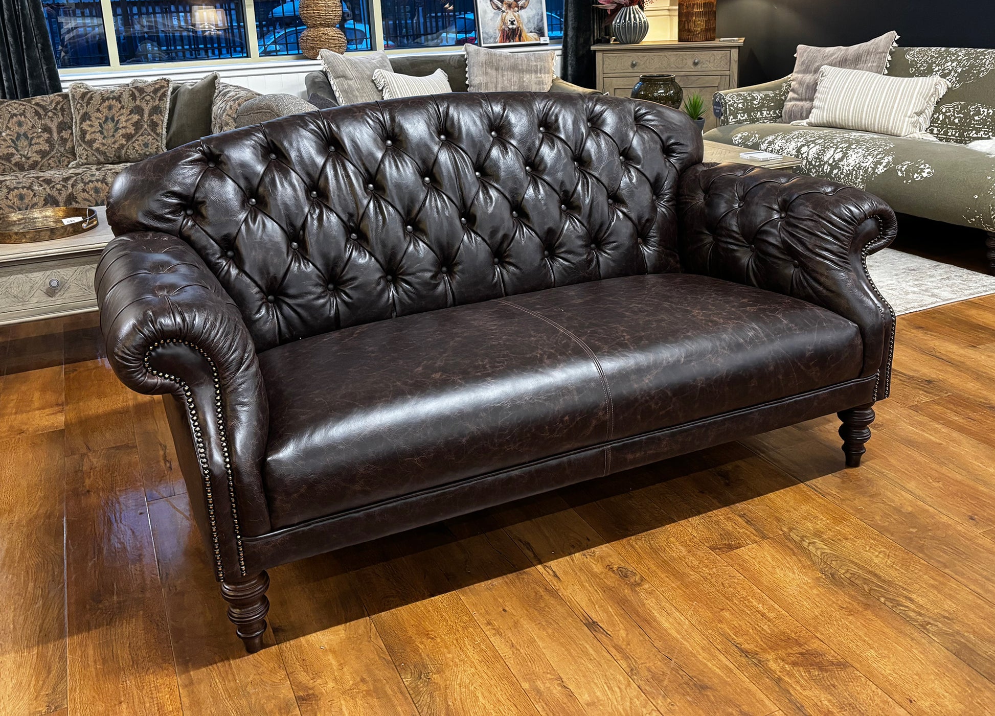 Tetrad Arbroath Petit Sofa in Dark Brown Leather Hide, in a classic chesterfield style with deep button tufting, scrolled arms and traditional turned legs