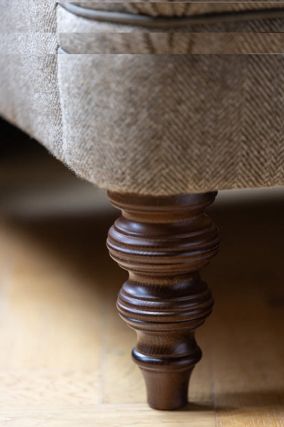 Tetrad Arbroath Petit Sofa in Jura Stag Harris Tweed upholstery with dark wooden feet