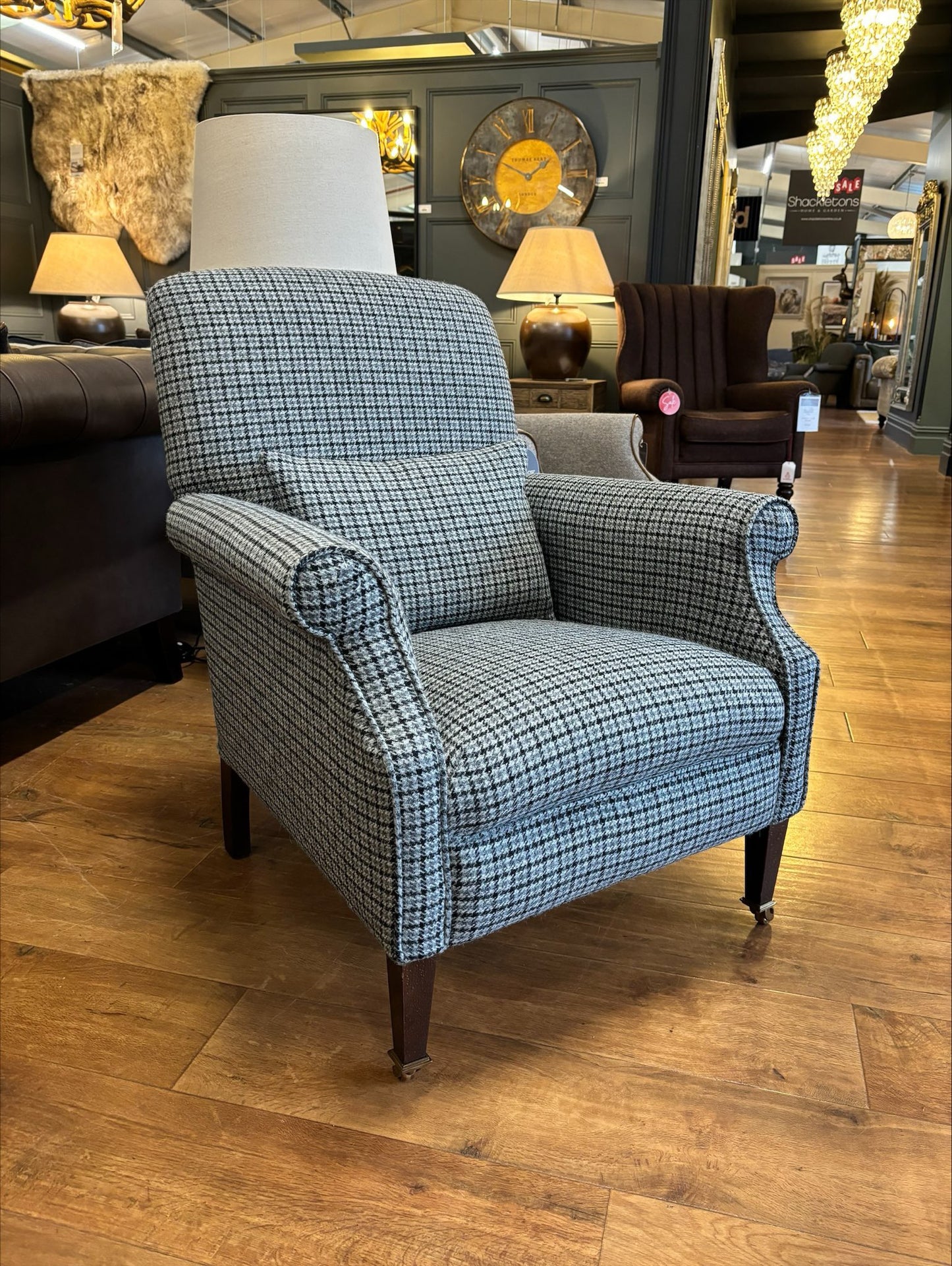 Tetrad Bowmore Chair in Ebony Hounds Harris Tweed upholstery, a classic houndstooth check pattern in charcoal and cream tones with brown wood legs