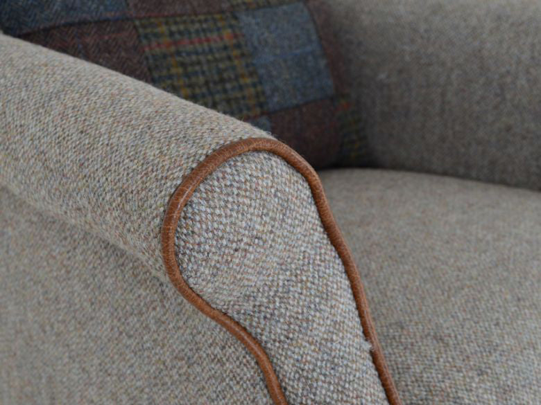 Tetrad Bowmore Chair in Genuine Heather Harris Tweed with Brompton Tan Leather Piping, scrolled arms and traditional tapered legs with brass castors
