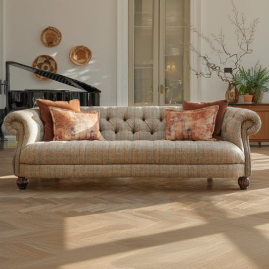 Tetrad Caledonian Midi Sofa in Bracken Herringbone upholstery, with stud detailed scrolled armrests, deep button tufting and dark wood turned feet