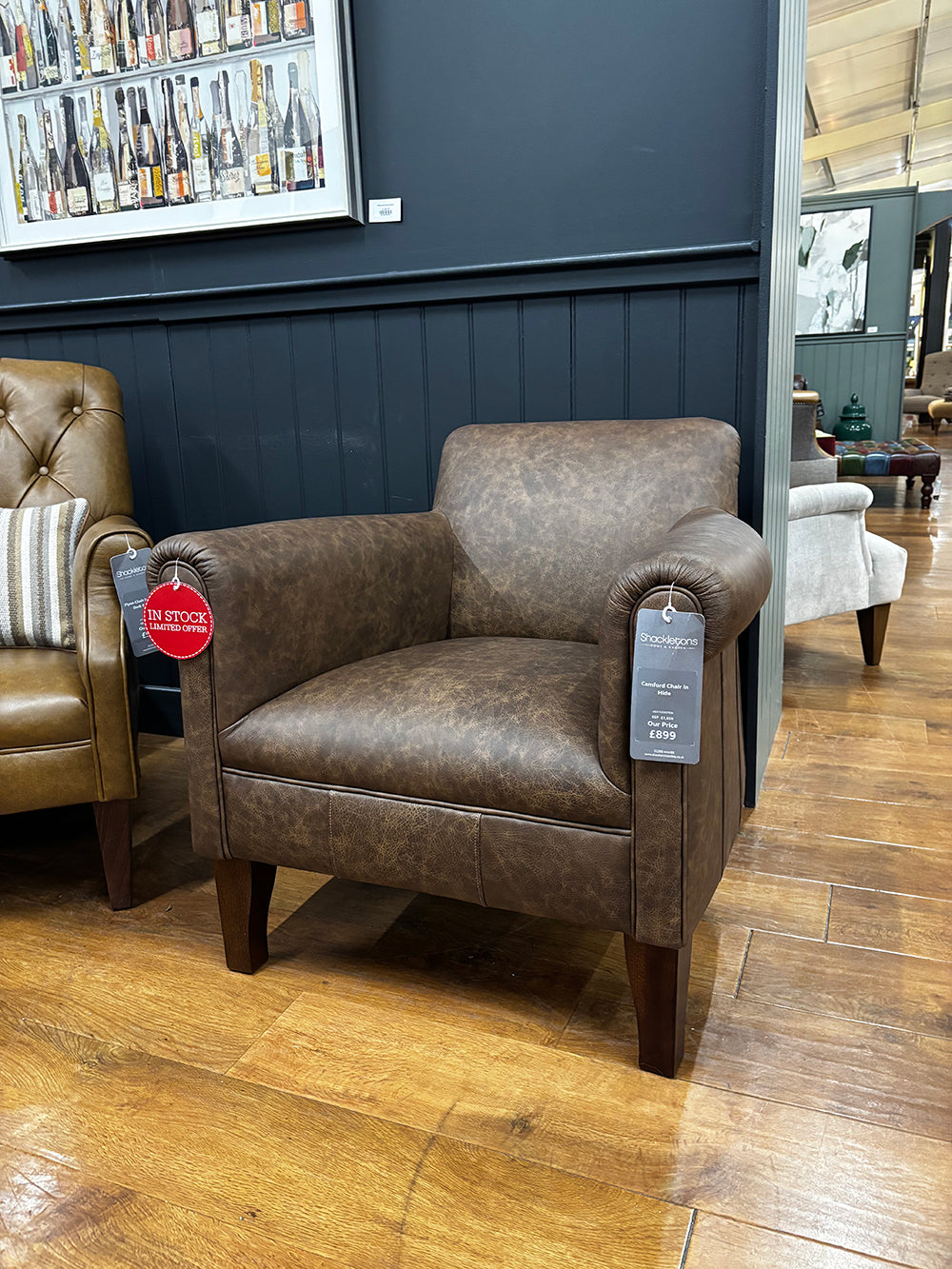Tetrad Camford Chair in Brown Distressed Leather features comfortable rounded arms and elegant tapered legs