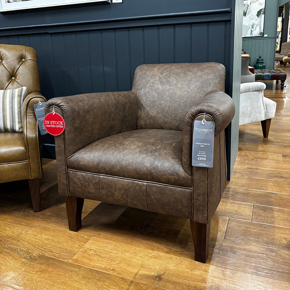 Tetrad Camford Chair in Brown Distressed Leather Hide with comfortable rounded arms, deep filled seat cushion and dark wood tapered legs