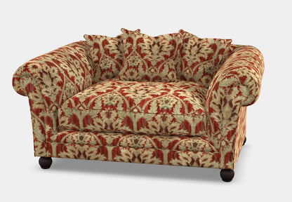 Tetrad Elgar Snuggler Sofa in Enigma Claret Fabric with deep filled seat cushions and matching scatter back cushions, plus dark wood feet