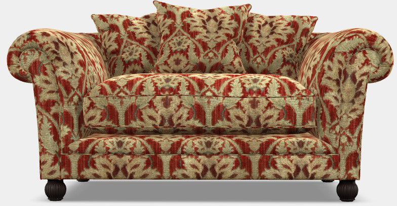 Tetrad Elgar Snuggler Sofa upholstered in Enigma Claret Fabric with matching scatter back cushions, and dark wood feet