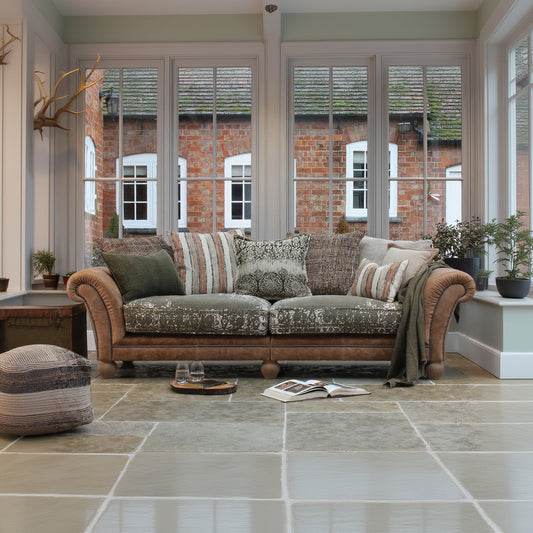 Tetrad Montana Grand Sofa in Atacama Nutmeg Leather can seat 3-4 people, crafted from a premium leather and patterned fabric with matching scatter cushions