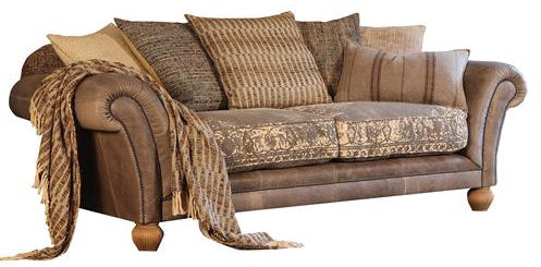 Tetrad Montana Midi Sofa seats 2-3 people and is handcrafted in Atacama Pewter Leather with scrolled arms and brass stud detailing, with crushed velvet seat cushions and coordinating scatter back cushions