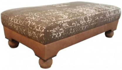 Tetrad Montana Stool in Atacama Nutmeg Leather hand crafted with luxurious materials, complemented by decorative brass stud detailing and traditional wooden Bun feet